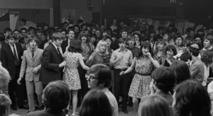 Embracing the Timeless Elegance: Exploring 60's Fashion Style for Women 9 a black and white photograph apturing a 1960s cultural event 2